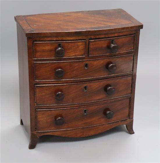 A Regency mahogany miniature bow-fronted chest of drawers H.28cm